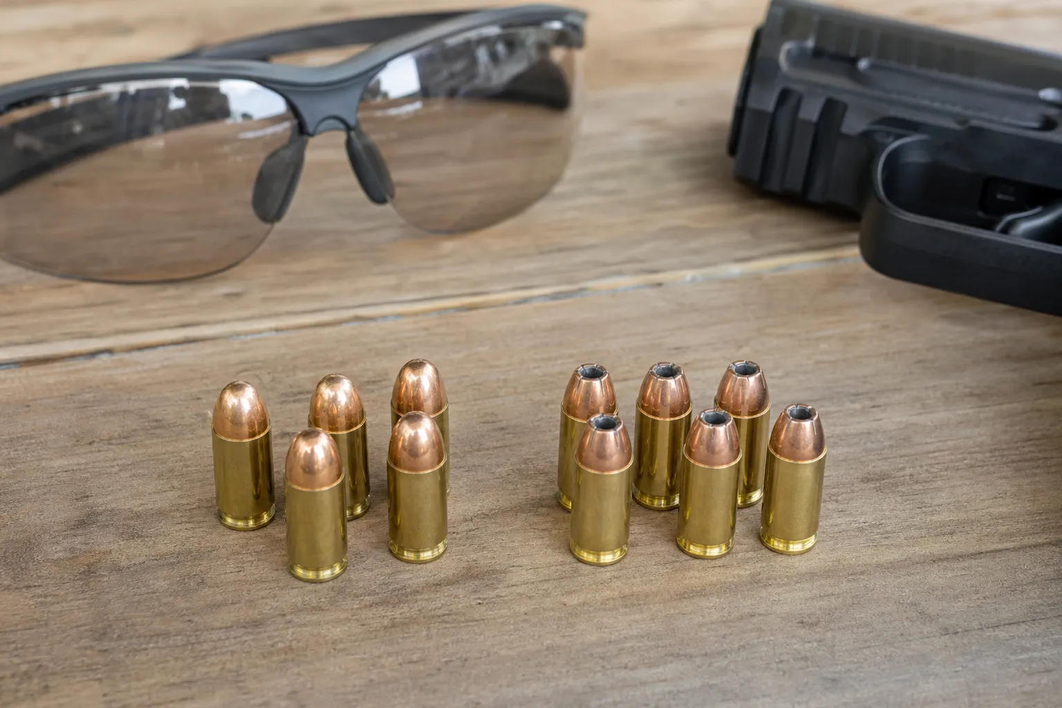 Two groups of handgun cartridges are arranged side by side to show the difference in bullet shape.