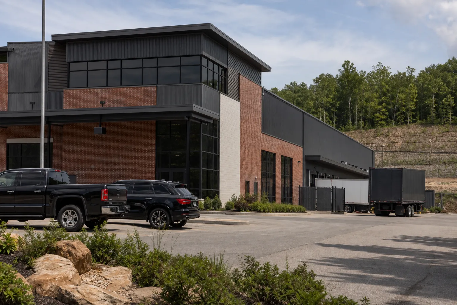 A daylight exterior view of a modern firearms manufacturing campus with an industrial feel.